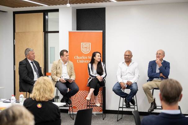 A group of people sitting in chairs

Description automatically generated