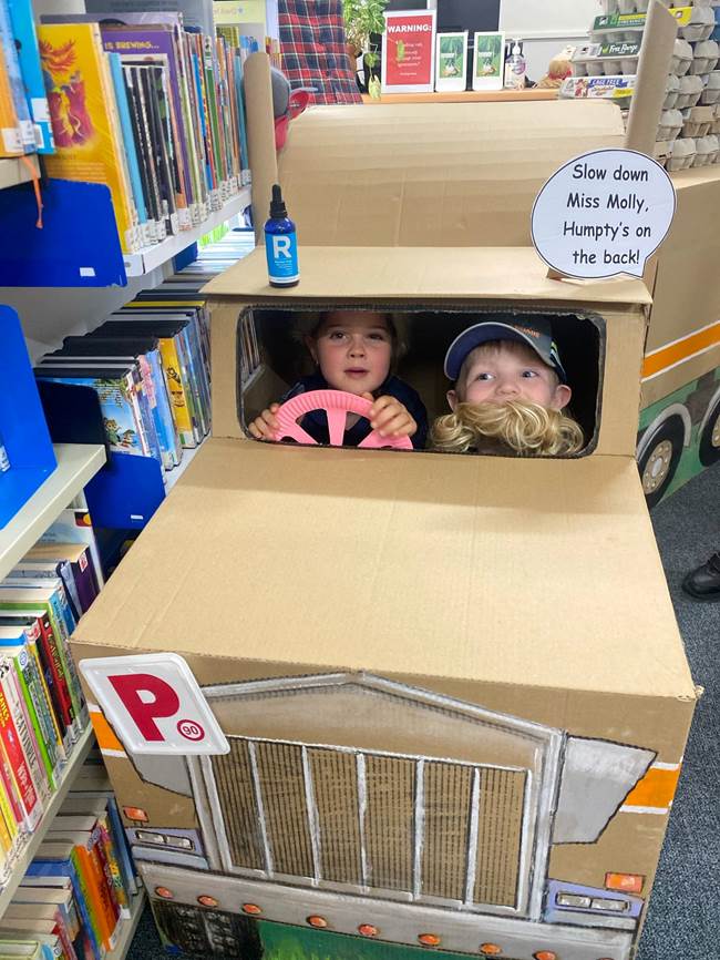 A group of kids in a cardboard car

AI-generated content may be incorrect.